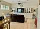 Living room with a built in bookshelf and tile floors at 30604 Apawamis Dr, Sorrento, FL 32776