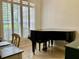 Elegant office with a piano, lots of bright natural light, and plantation shutters at 30604 Apawamis Dr, Sorrento, FL 32776
