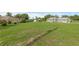 Spacious backyard featuring a large lawn, a gazebo, and mature trees for privacy at 316 Dupont Cir, Howey In The Hills, FL 34737