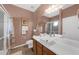 Well-lit bathroom featuring a vanity, shower, and stylish decor at 316 Dupont Cir, Howey In The Hills, FL 34737