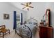 This bedroom features natural lighting and an iron bed frame at 316 Dupont Cir, Howey In The Hills, FL 34737