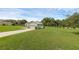 Beautifully maintained house with a spacious two-car garage and an expansive green lawn that enhances the curb appeal at 316 Dupont Cir, Howey In The Hills, FL 34737