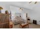 Cozy living room featuring tile floors, ceiling fan, and comfortable seating at 316 Dupont Cir, Howey In The Hills, FL 34737