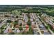 Aerial neighborhood view highlighting the community's serene setting with mature trees and landscaping at 32948 Rambling Oaks Ct, Leesburg, FL 34748
