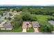 Aerial view of a well-maintained home, showcasing the lush greenery and neighborhood at 32948 Rambling Oaks Ct, Leesburg, FL 34748