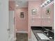 Bathroom featuring vanity with granite countertop, white fixtures, and shower-tub combo at 32948 Rambling Oaks Ct, Leesburg, FL 34748