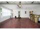 Spacious garage with ample storage space and access to the interior at 32948 Rambling Oaks Ct, Leesburg, FL 34748