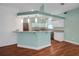 Kitchen with white cabinets, granite countertops, and modern stainless steel appliances at 32948 Rambling Oaks Ct, Leesburg, FL 34748
