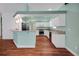 Open kitchen with stainless steel appliances and a breakfast bar for casual dining at 32948 Rambling Oaks Ct, Leesburg, FL 34748