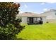 Enjoy this backyard with an outdoor living space that includes a gazebo for outdoor entertaining and relaxing at 33647 Sky Blossom Cir, Leesburg, FL 34788