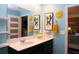 Bright bathroom with a double vanity, quartz counters, and decorative sunflower accents at 33647 Sky Blossom Cir, Leesburg, FL 34788