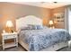 Cozy bedroom with a large bed, soft lighting, and tasteful decor creating a relaxing atmosphere at 33647 Sky Blossom Cir, Leesburg, FL 34788