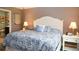 Serene bedroom featuring a plush bed, bedside tables, and calm hues for a peaceful retreat at 33647 Sky Blossom Cir, Leesburg, FL 34788