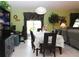 Bright dining area with a table set for six, opening onto a patio with natural light at 33647 Sky Blossom Cir, Leesburg, FL 34788