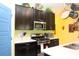 Stylish kitchen features dark cabinets, stainless steel appliances, and a bright, clean aesthetic at 33647 Sky Blossom Cir, Leesburg, FL 34788