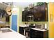 Charming kitchen with stainless steel appliances, sleek countertops, and a pop of color with the blue door at 33647 Sky Blossom Cir, Leesburg, FL 34788