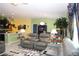 This living room is perfect for relaxing and entertaining with its open layout and stylish furnishings at 33647 Sky Blossom Cir, Leesburg, FL 34788