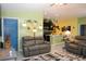 Inviting living area featuring a cozy sofa, stylish decor, and plenty of natural light, creating a warm and welcoming space at 33647 Sky Blossom Cir, Leesburg, FL 34788