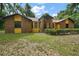 Charming single-story home with a well-maintained front yard and brick and siding accents at 37236 Cherry Lake Rd, Fruitland Park, FL 34731