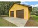 Detached garage offering ample parking and storage space, with a concrete driveway at 37236 Cherry Lake Rd, Fruitland Park, FL 34731