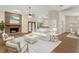 Bright living room with brick fireplace, ceiling fan, and modern furniture arrangement at 37236 Cherry Lake Rd, Fruitland Park, FL 34731