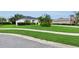 Charming home with well-maintained landscaping and a lush, green lawn at 3819 Saint Emma Ct, Leesburg, FL 34748