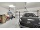Spacious two car garage with ample room for storage and overhead doors at 3819 Saint Emma Ct, Leesburg, FL 34748
