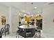 Bright kitchen featuring a central island with stools, a full suite of appliances, and plenty of cabinet space at 3819 Saint Emma Ct, Leesburg, FL 34748