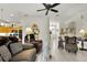 Bright living room with neutral walls, tile flooring, and ornate décor accents at 3819 Saint Emma Ct, Leesburg, FL 34748