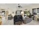 Open living space featuring tile flooring, eclectic decor, and access to outdoor area at 3819 Saint Emma Ct, Leesburg, FL 34748