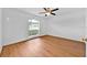 Bright bedroom with a large window and hardwood floors at 39 Pine Court Dr, Ocala, FL 34472