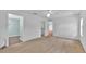 Bright bedroom with neutral carpet, ceiling fan, and ensuite bathroom access at 39 Pine Court Dr, Ocala, FL 34472