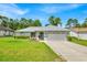 Charming single-story home with well-maintained lawn and attached two-car garage at 39 Pine Court Dr, Ocala, FL 34472