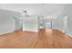 Spacious living room featuring vaulted ceilings, wood floors, and ample natural light at 39 Pine Court Dr, Ocala, FL 34472