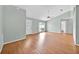 Bright living room with wood floors, large window, and ample natural light at 39 Pine Court Dr, Ocala, FL 34472