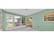 Enclosed sunroom featuring white tile floors and lots of light at 39 Pine Court Dr, Ocala, FL 34472