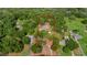 Aerial view of the property showing the house and surrounding trees at 39132 Grays Airport Rd, Lady Lake, FL 32159