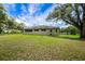 Expansive green backyard with trees at 39132 Grays Airport Rd, Lady Lake, FL 32159