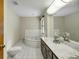 Bathroom features a sunken tub, dual vanity, and a tile floor at 39132 Grays Airport Rd, Lady Lake, FL 32159