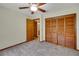 Spacious bedroom with a ceiling fan and large closet at 39132 Grays Airport Rd, Lady Lake, FL 32159