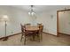 Dining room with hardwood table and chandelier at 39132 Grays Airport Rd, Lady Lake, FL 32159