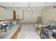 Spacious garage with a lawn mower, storage, and a door to the home's interior at 39132 Grays Airport Rd, Lady Lake, FL 32159