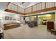 A spacious living room that features a dining area, kitchen and stylish staircase at 39132 Grays Airport Rd, Lady Lake, FL 32159