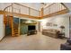 Open living room featuring a spiral staircase, a loft and great lighting at 39132 Grays Airport Rd, Lady Lake, FL 32159