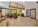 Open-concept living area with high ceilings, a loft, and wood-look flooring at 39132 Grays Airport Rd, Lady Lake, FL 32159