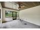 Enclosed patio with screen windows, ceiling fan and concrete flooring at 39132 Grays Airport Rd, Lady Lake, FL 32159