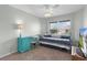 A sunlit bedroom featuring a trundle bed, desk, and chair at 3978 Nottingham Loop, The Villages, FL 32163