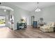 Bright entryway with hardwood floors, arched entrance, and plenty of space to greet guests as they enter at 3978 Nottingham Loop, The Villages, FL 32163