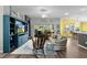 Comfortable living room with hardwood floors, ceiling fan, lots of seating and a view of the screened patio at 3978 Nottingham Loop, The Villages, FL 32163