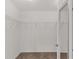 A bright walk-in closet with carpet flooring and metal storage shelving at 3978 Nottingham Loop, The Villages, FL 32163
